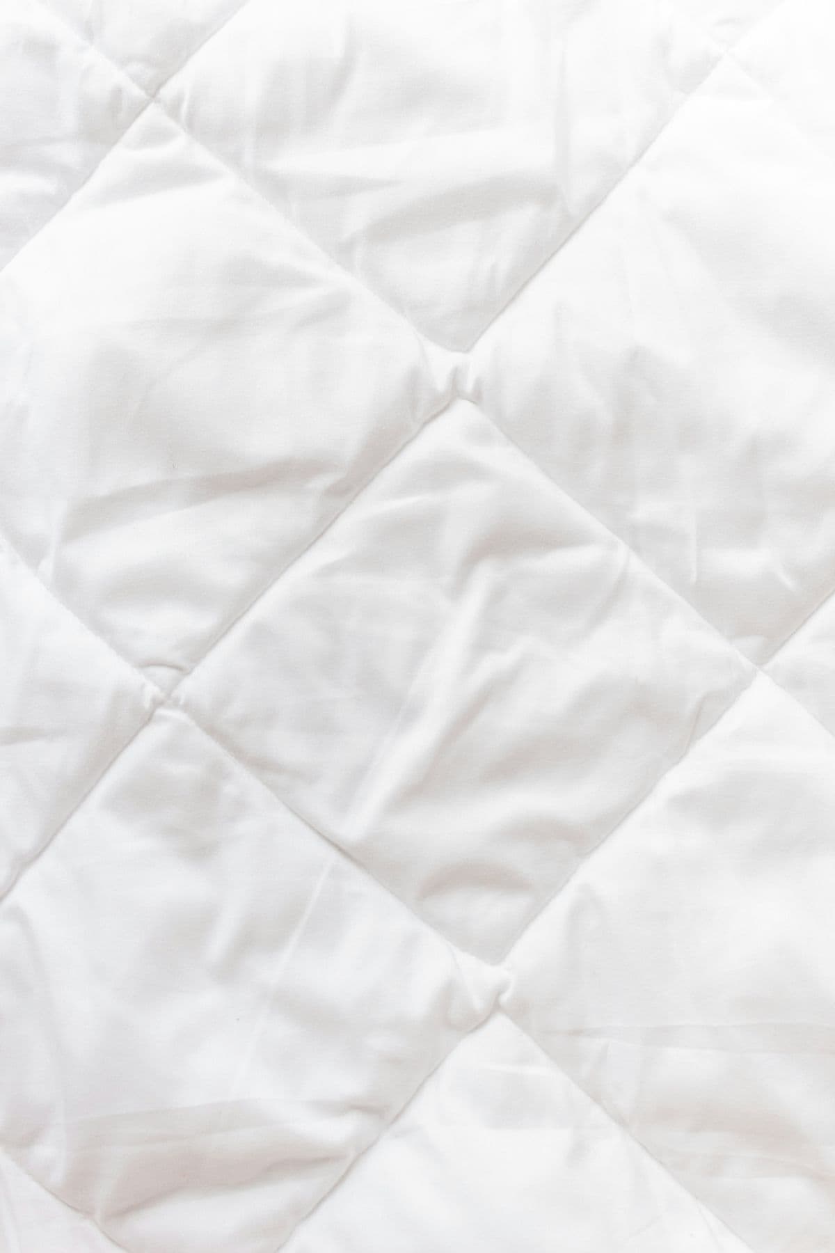Quilted white pillow protector